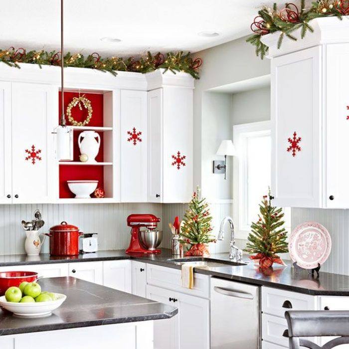 Christmas decor above kitchen cabinets